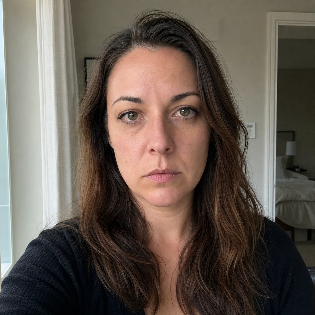 Before edit: an indoor portrait with a neutral expression