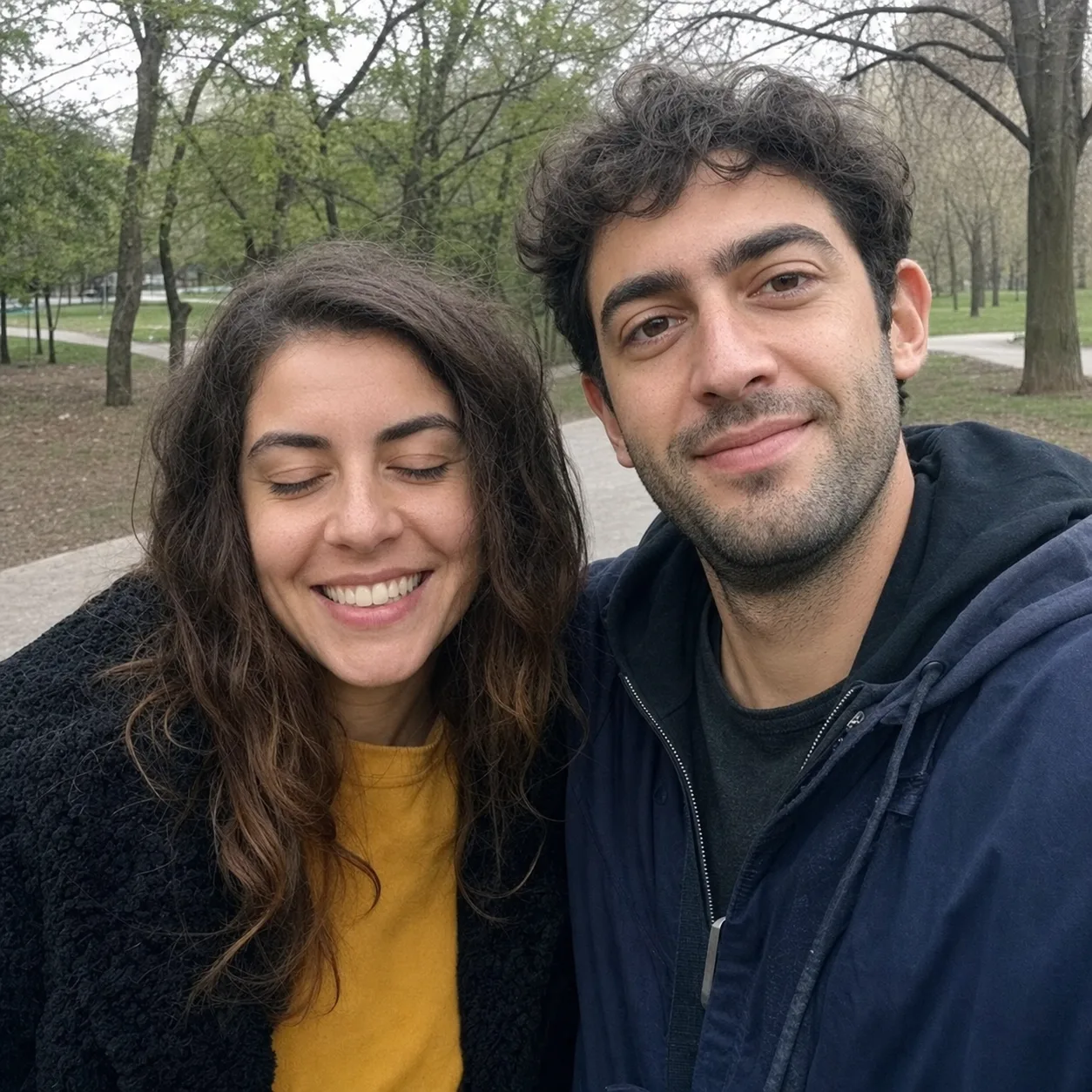 Before edit: a couple's park portrait with the woman's eyes closed